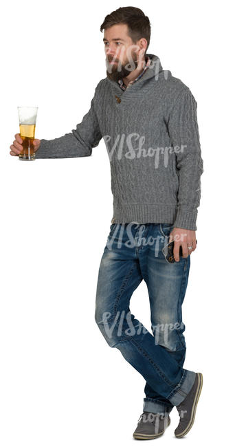man standing at a bar counter and drinking beer