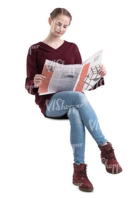 young woman sitting and reading a newspaper