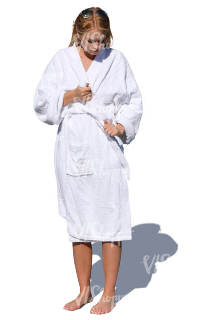 woman standing and tying her bathrobe belt
