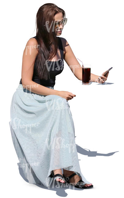 young woman sitting in a cafe and drinking cola