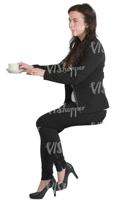 woman sitting at a counter and drinking coffee