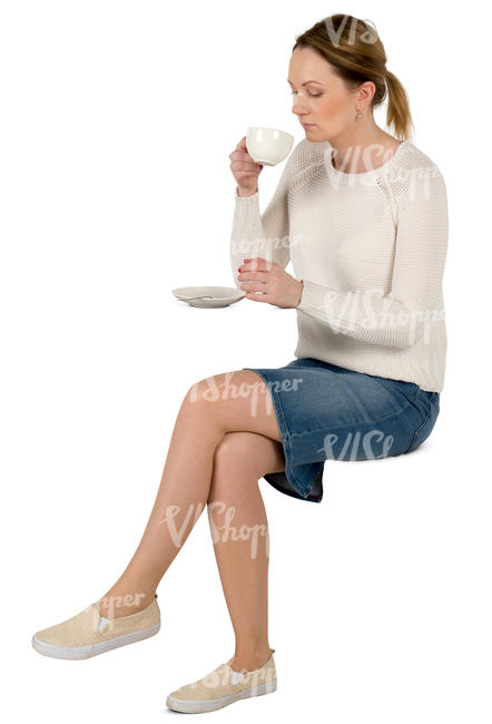 woman sitting in a cafe and drinking coffee