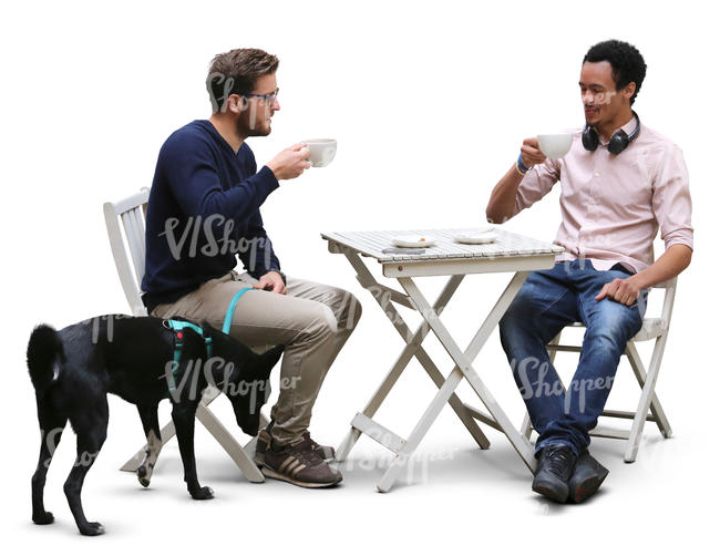 two men and a dog sitting in a cafe