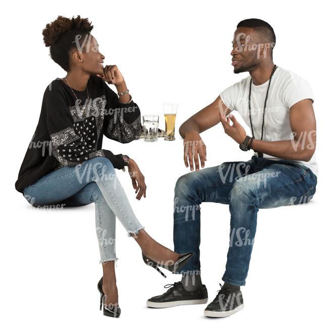 african man and woman sitting in a cafe and talking