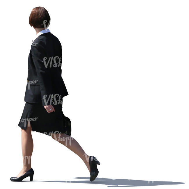 businesswoman in a black costume walking on the street
