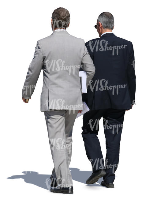 two older businessmen in suits walking side by side