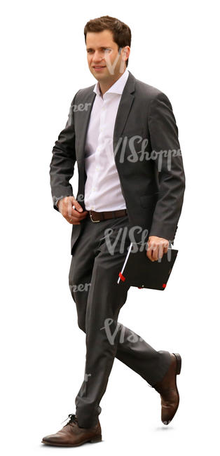 businessman with a notebook walking in the office