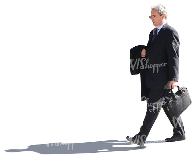 senior businessman walking on the street
