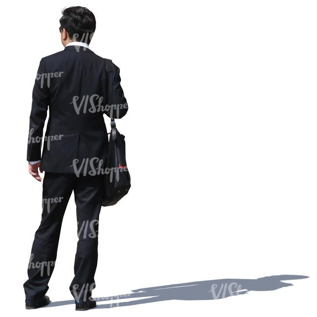 asian businessman in a black suit standing