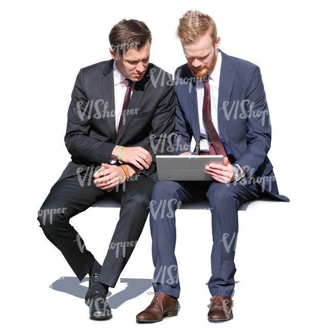 two businessmen sitting and looking at a tablet