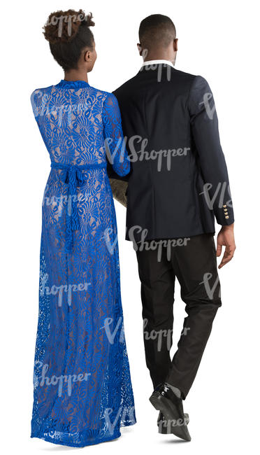 african couple in formal attire walking arm in arm