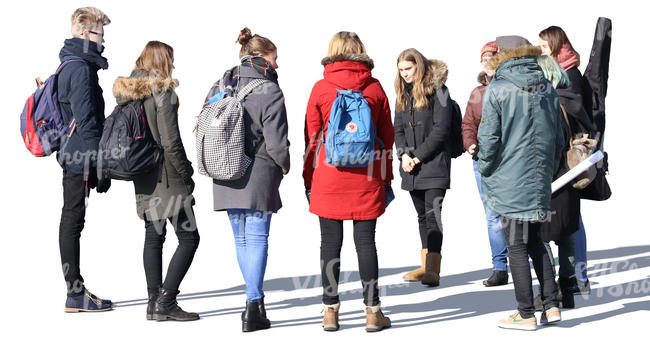 group of young people standing and talking