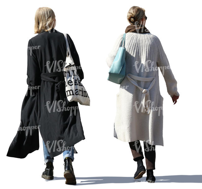 two women in long jackets walking