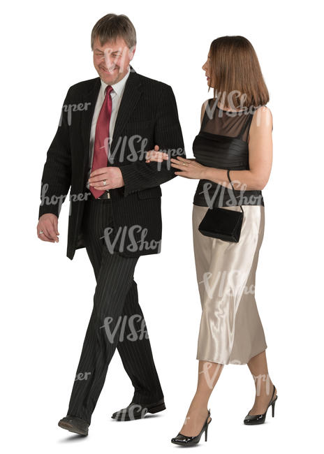 couple in fancy clothes walking arm in arm