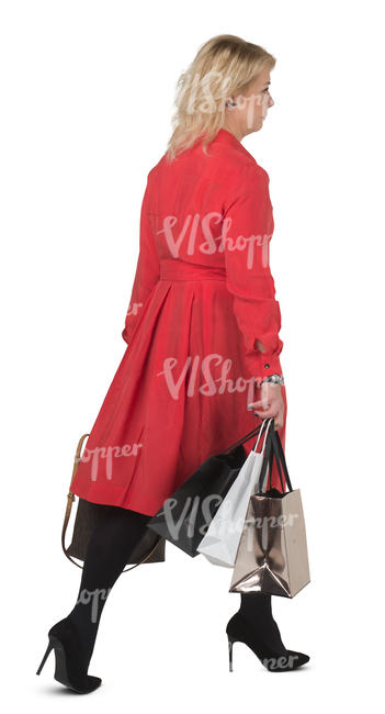 woman in a red dress carrying shopping bags walking