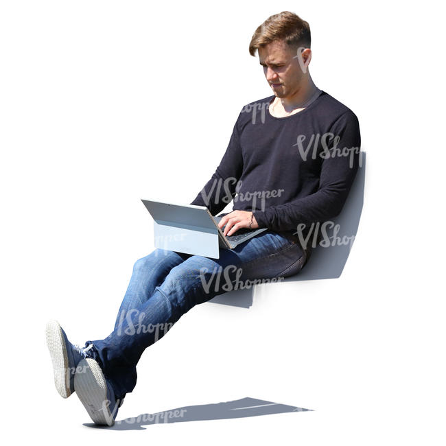 man sitting with laptop on his knees