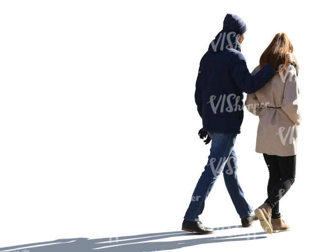 backlit couple walking