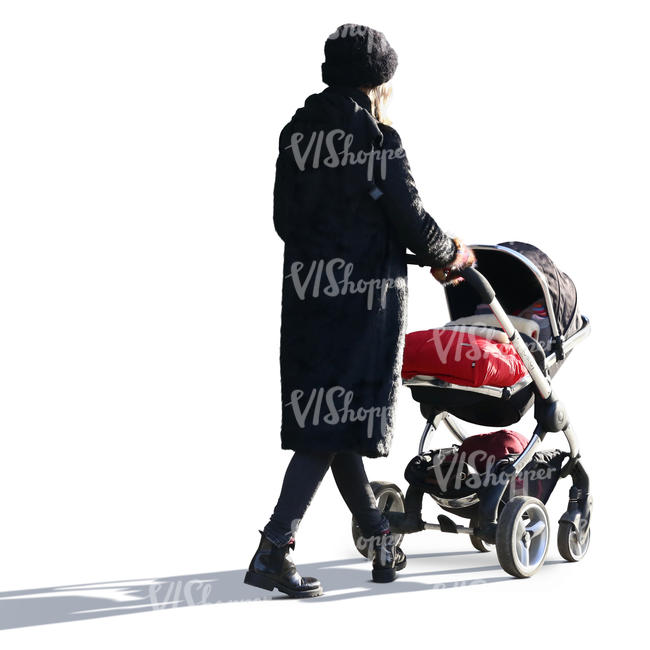 backlit woman in a black outfit walking with a baby carriage