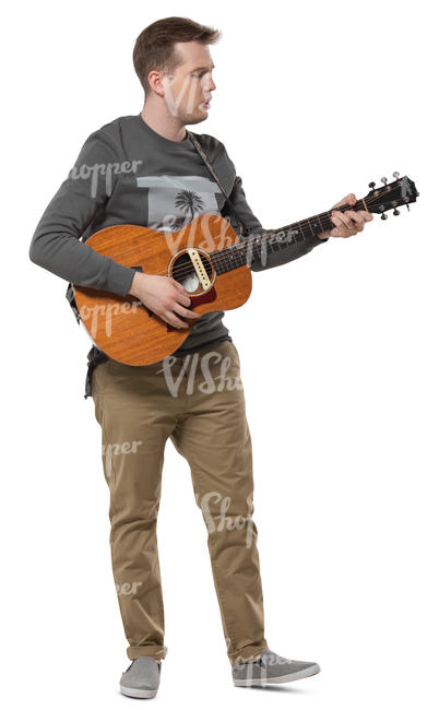 man standing and plying a guitar