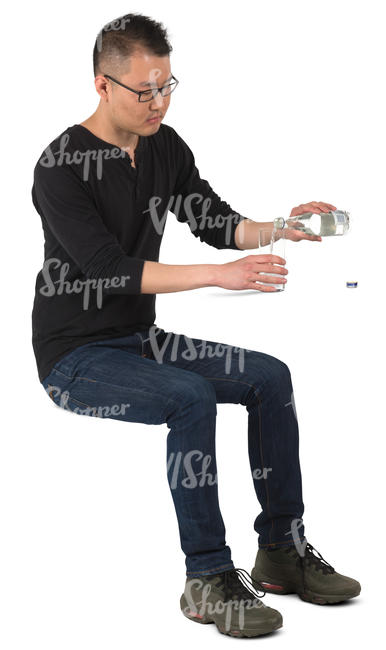 asian man sitting and pouring water in the glass