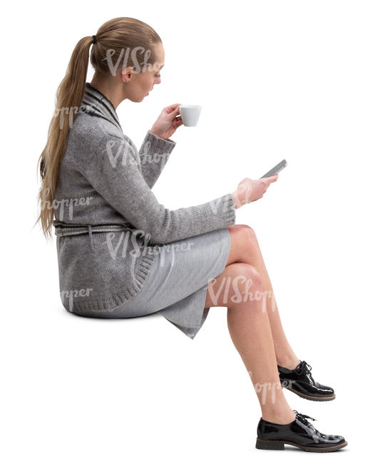 woman sitting and drinking coffee