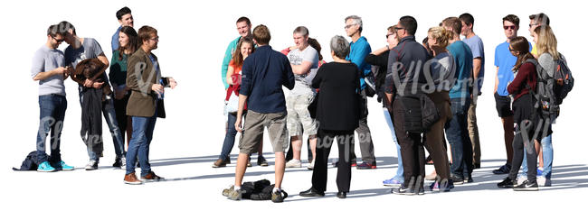 group of people standing and listening to a guide