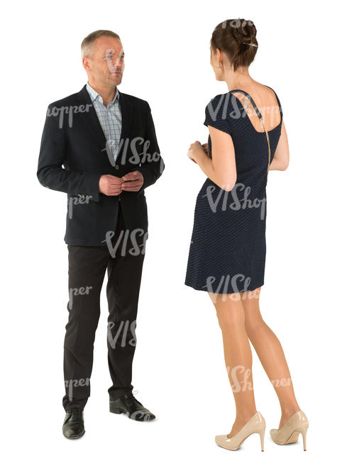 man and woman talking at a formal gathering