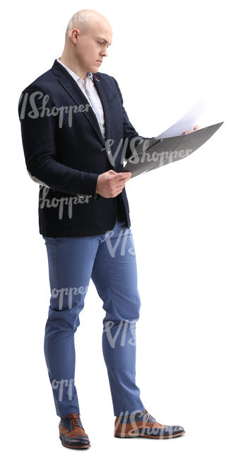 businessman standing and looking at papers