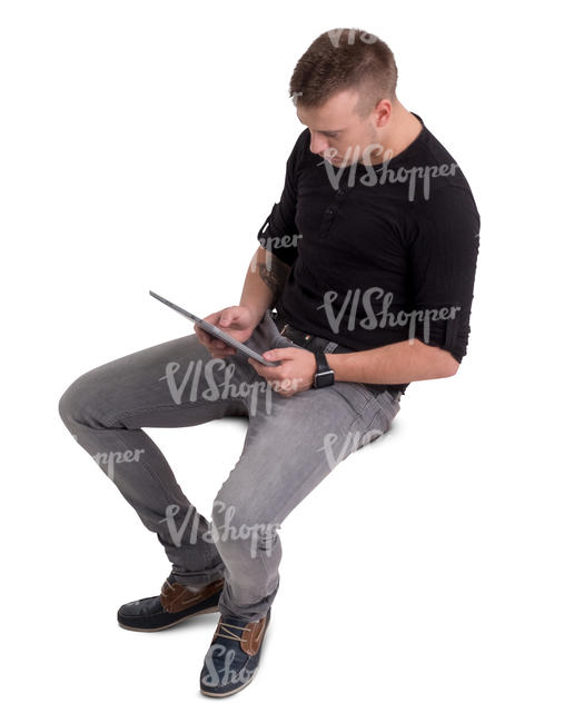 man sitting with a tablet seen from above