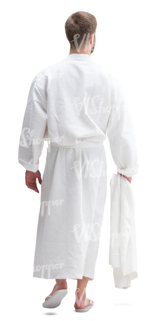 man in a bathrobe walking seen from back