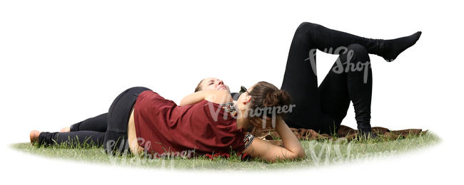 two women lying on the grass in a park
