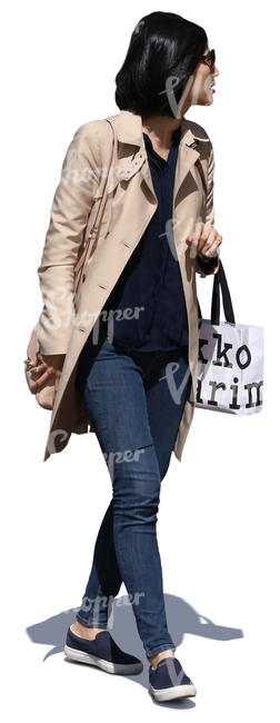 woman walking and carrying a shopping bag