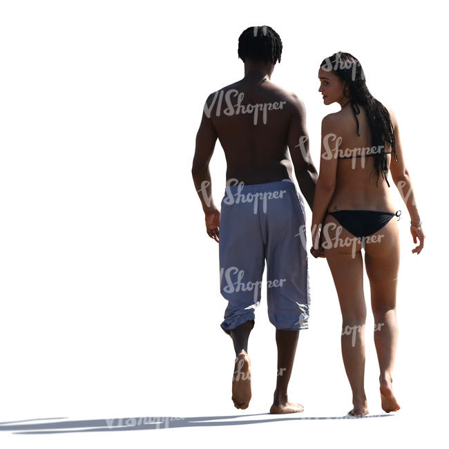couple walking hand in hand on the beach
