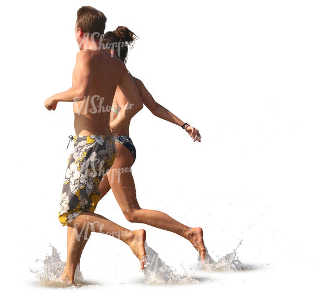 man and woman running hand in hand into water