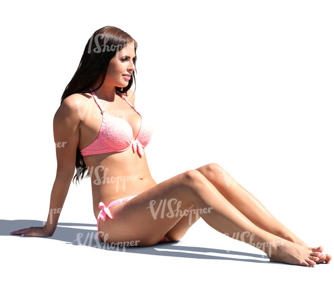 woman in a bikini sitting and sunbathing