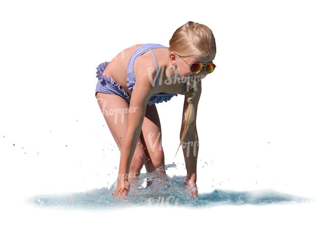 little girl standing in the water