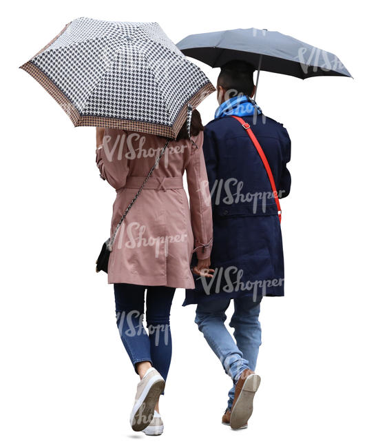 couple with umbrellas walking in the rain