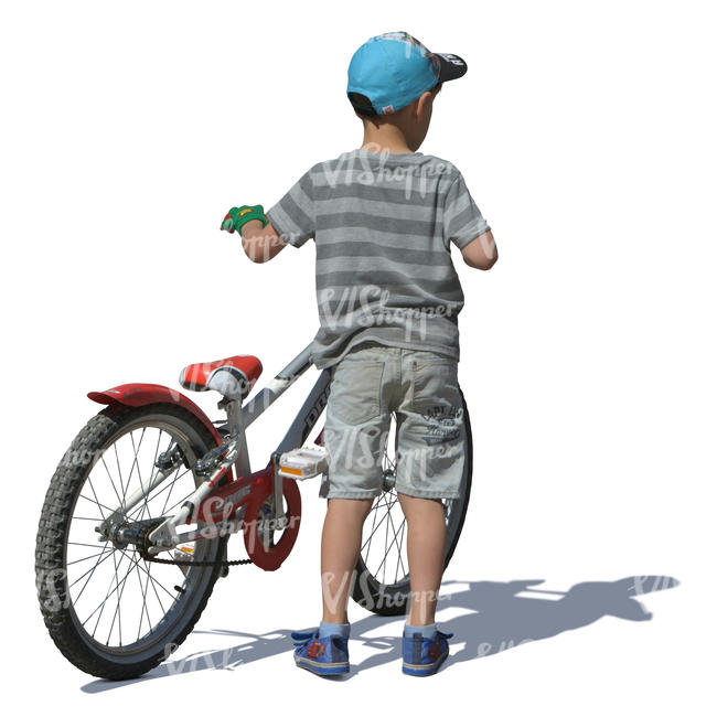 little boy standing with a bicycle
