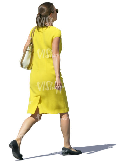 woman in a yellow dress walking