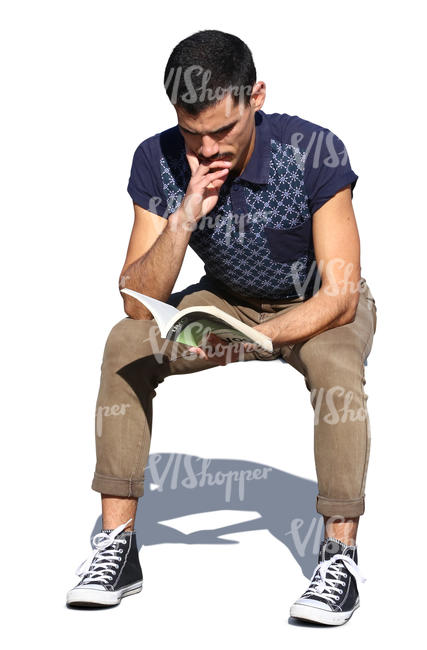 man sitting in sunlight and reading a book