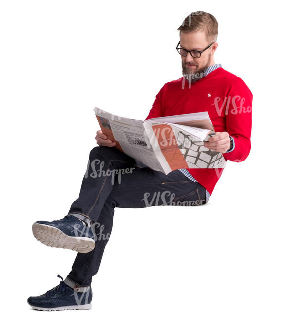 man in a red sweater sitting and reading