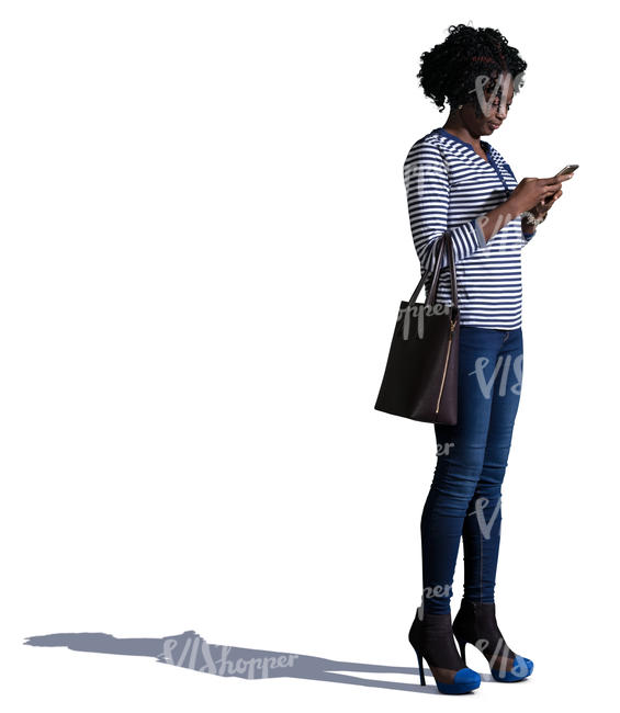 african woman standing and texting