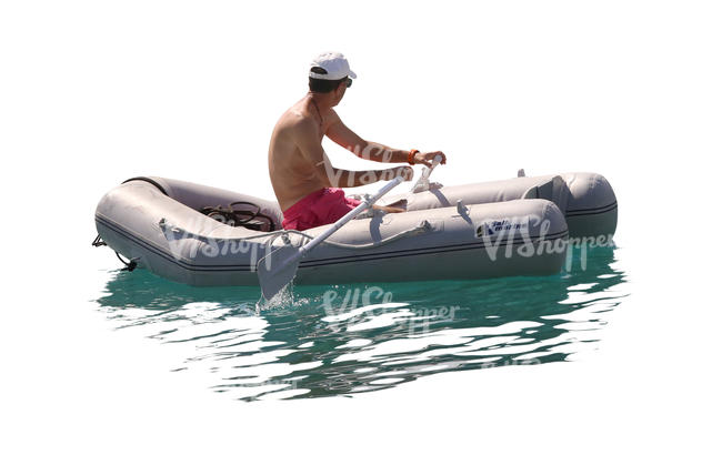 man rowing an inflatable boat