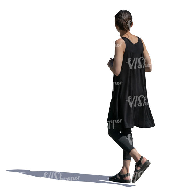 woman in a black summer dress walking