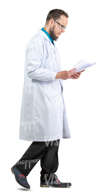 male doctor walking and reading papers