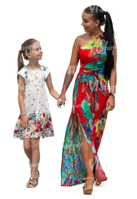mother and daughter in summer dresses walking hand in hand
