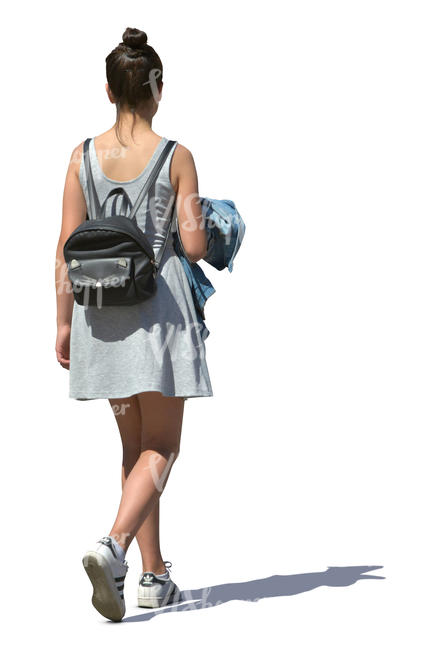 woman in a grey summer dress walking