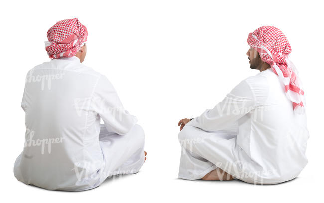 two arab men sitting on the floor and talking