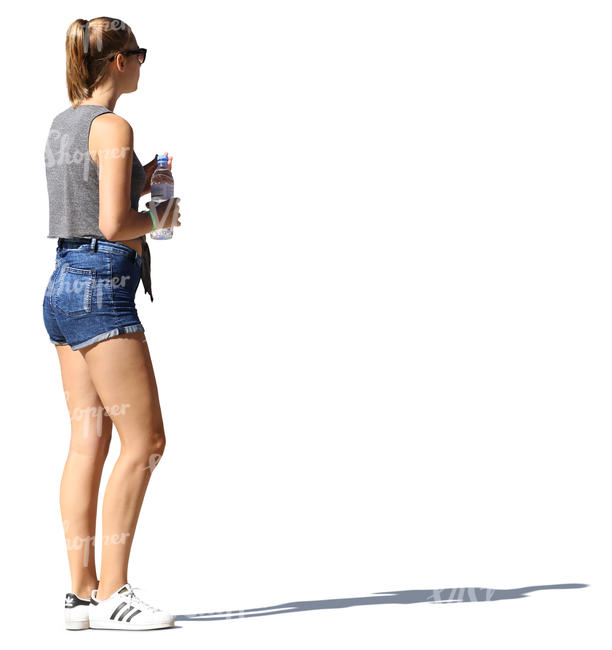 woman standing and holding a water bottle