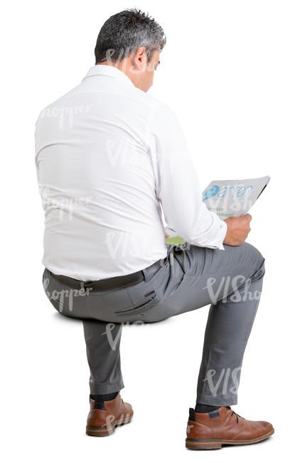 businessman sitting and reading a newspaper